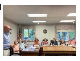 Gladwin Schools Superindent Chuck Frisbie addresses members of the Gladwin Couty Council.