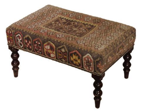 Rugs aren’t just for covering the floor. An antique kilim rug, a style originating in Western Asia, found another life as upholstery for a 20thcentury bench. THOMASTON PLACE AUCTION GALLERIES