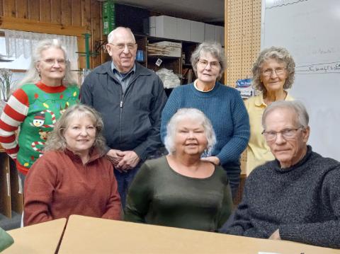 Pictured left to right, seated, are Connie Maedel Diehl, Linda Clark, and Mark Winslow. From left to right, standing, are Linda L. Hall, Ken Neubecker, Anne Cooke, and Patricia Riegle.