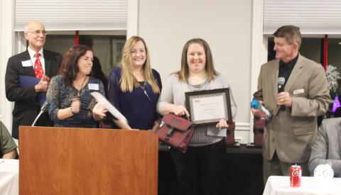 Pictured is Jennifer Sheldon accepting her award, with (starting at left) Legislative Aide Joel Johnson from Congressman John Moolenaar’s office, Karen Moore, Gladwin County, Michigan Works! Region 7B Gladwin County Career Advisor Suzanne Sundberg, Jennifer Sheldon, and Michigan Works! Region 7B Executive Director Mark L. Berdan looking on.