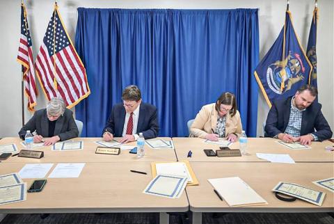 The Michigan Board of State Canvassers signed certificates to officially certify the results of the 2024 General Election. Pictured from left to right: Chair Mary Ellen Gurewitz (D), Vice-Chair Richard Houskamp (R), member Jeannette Bradshaw (D), and member Anthony Daunt (R).