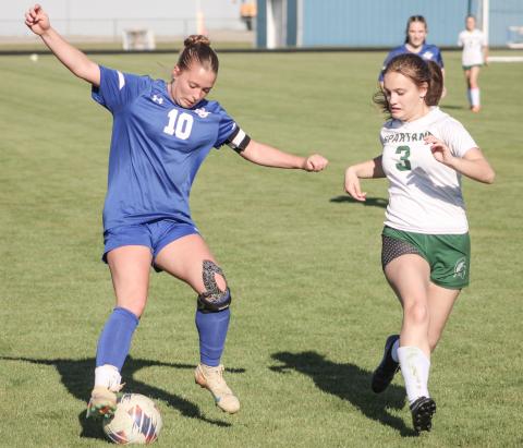 Madisyn Lockwood puts the moves on the Pinconning defense during last week’s 4-4 tie with the Spartans.