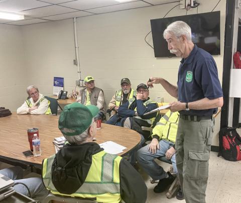 Gladwin County Emergency Management Director Bob North passes out instructions to Community Emergency Response Team volunteers prior to a training exercise that was held Saturday.
