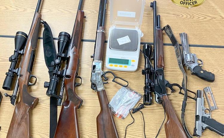 Michigan DNR conservation officers seized 2 grams of cocaine, two pistols and four rifles, from three Oakland County men in two separate vehicles, located north of Atlanta, on Nov. 15.