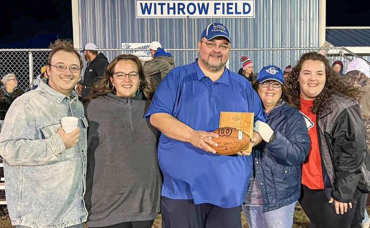 Pastor Withrow and his family on the newly named Withrow Field.