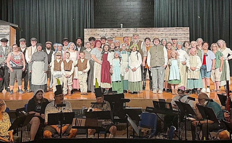 Cast and crew of Fiddler On The Roof with the orchestra on a rehearsal night.