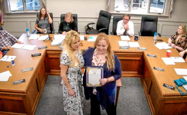Mayor Sarah Kile (right) presented a proclamation to Lisa Kujawa (left) of Golden Key Camp at a Gladwin City Council meeting on Monday, October 21. YOUTUBE: CITY OF GLADWIN