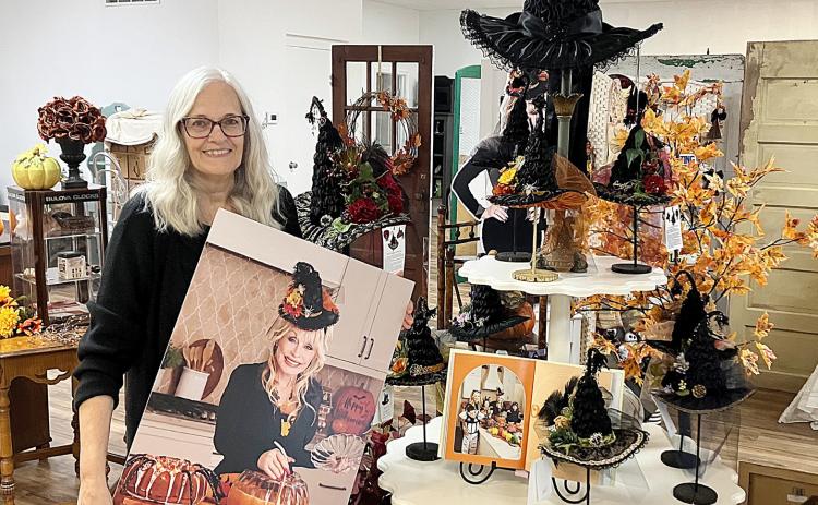 Gladwin’s Karen Steinkraus made the witch hat worn by the late Dolly Parton in a picture that appeared in the star’s latest cookbook and a copy is on display at The Golden Tree on East Maple.