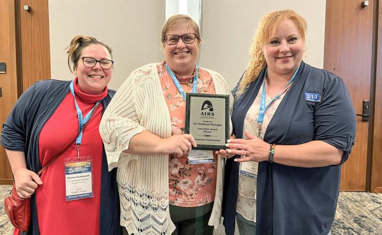 211 Northeast Michigan received the Innovator of the Year Award in Cooperative Relationships at the national conference for InformUSA during the 50thanniversary event on August 1, 2023, in Orlando, Florida. They won the award against second finalist 211 LA County for creating the LIFT Program with United Way of Midland County. Pictured left to right are: Shirley Southworth, Chiara Cameron-Wood, and Sarah Kile.
