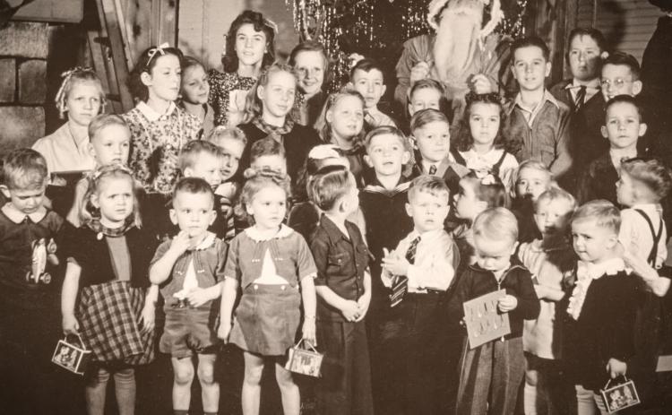 Christmas has long been a time for kids meetings Santa Claus. This one was taken in the Buckeye Township Hall during the prosperous oil boom years. It was probably taken just after the attack on Pearl Harbor and America’s entry into WWII, but before the reality of what that would mean had really sunk in. There are no identifications of any of the children, but perhaps some readers may recognize the event and perhaps even provide identifications. Send them to shaupt@thegladwincountyrecord.com.
