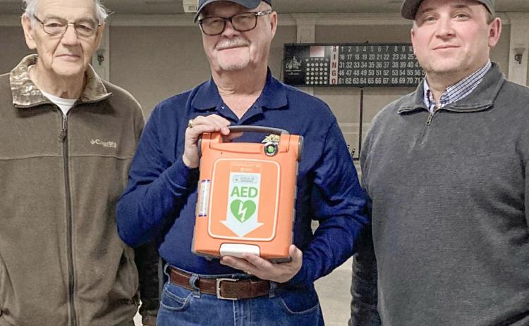 Pictured from left to right are Knights of Columbus (KofC) Grand Knight David Cooper, David Poxon, and Matt Fruchey. David Poxon generously funded the purchase of a new portable defibrillator for the Knights of Columbus as a memorial to his deceased wife, Janet Poxon. Matt Fruchey, an Emergency Medical Technician working for MyMichigan, demonstrated the unit to 20 Knights of Columbus members. “Thanks to David Poxon and Matt Fruchey for making us safer,” said Cooper.