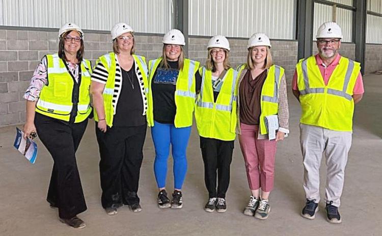 Pictured are: Dorothy Mott, Chris Rowley, Amy Bunting, Jordan Ensing, Alexa Carey and Cal Seelye II. Mt. Pleasant Area Convention &amp; Visitors Bureau President and CEO Chris Rowley, along with members of the MPACVB Board of Directors, toured the future site of the Morey Event Center on Mid Michigan College’s Mt. Pleasant campus.