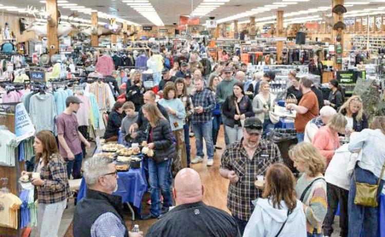 Crowd of people inside Jays Sporting Goods for A Northern Tradition event.