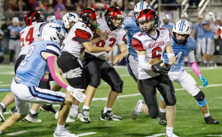 Beaverton’s Mason Barth looks for some hard-to-find running room during Friday night’s loss at undefeated Meridian. JESSICA KELLER