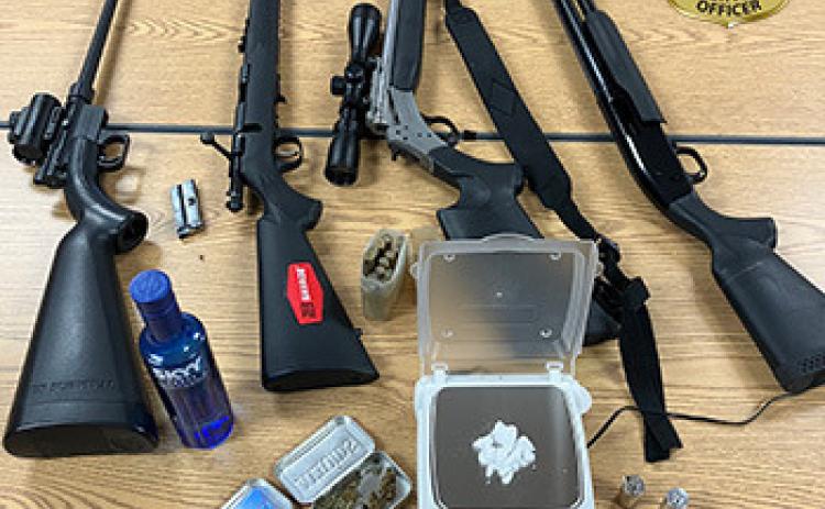 Conservation officers seize four firearms and drugs during traffic stop