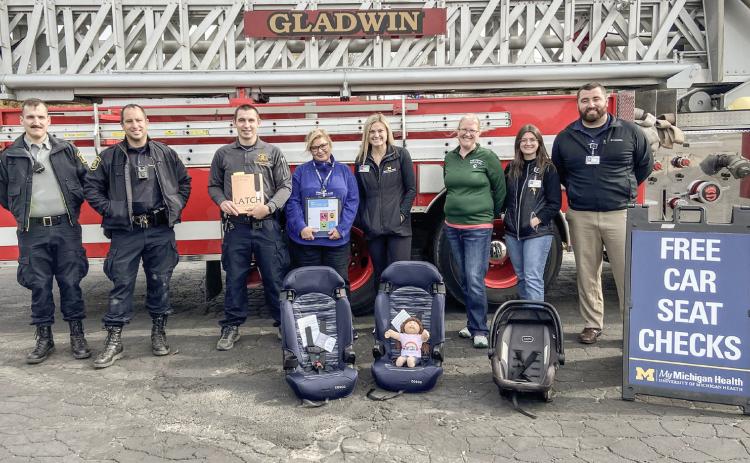 Staff at the Car Seat Check Event in Gladwin from left to right Brennan Snow, Shane Noble, Christopher Kustra, Kelli Jankens, Kelsey Killinger, Lindsay Walker, Sydney Zuke, Christian Church.