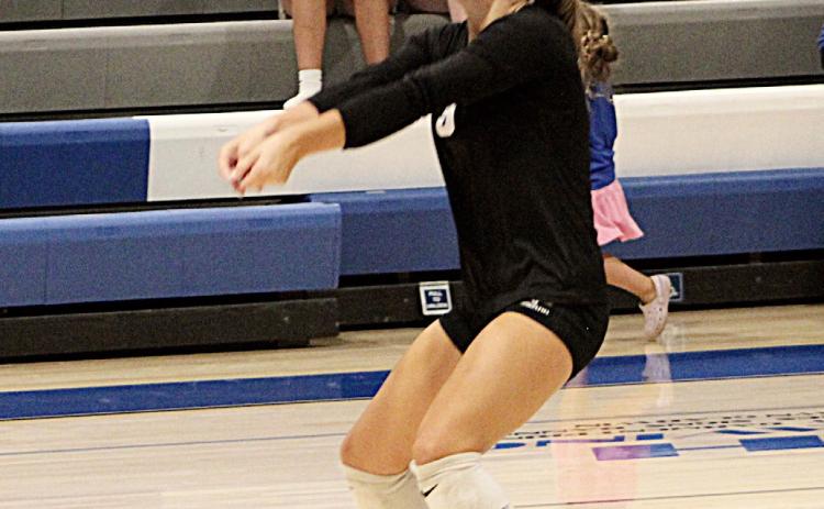 Gladwin’s Bailey Snyder gets the job done on serve receive during a recent match.