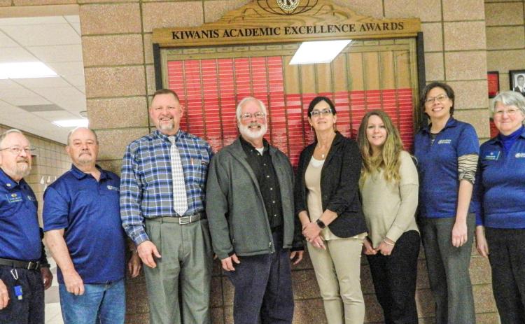 Several members of the Gladwin Kiwanis Club, along with Chris Rusher, Dean of Students, are shown in front of the academic display board recently presented to the Beaverton Jr./Sr. High School (BJSHS). This board showcases the top students each year in a variety of curriculum. The board was designed and built by master craftsman, Al vonMatt, of Gladwin.