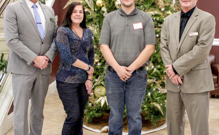 Pictured left to right are State Representative Mike Hoadley, Gladwin County Commissioner Karen Moore, Jason Ash, and Michigan Works! Region 7B Executive Director Mark L. Berdan.