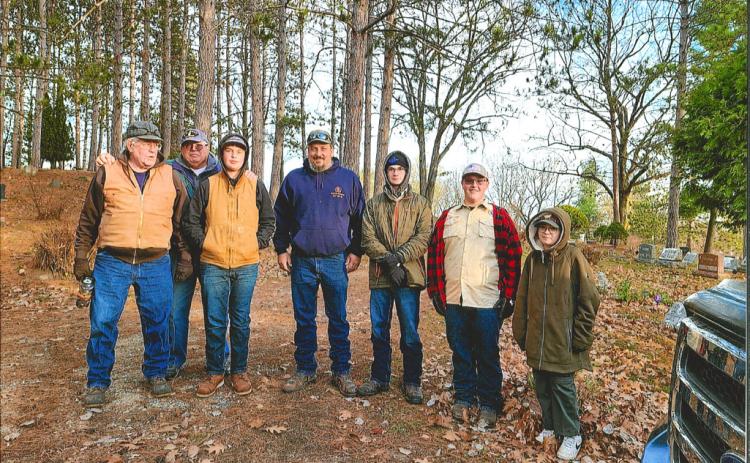 On Saturday, November 12, this group of American Legion Post 171 members, Boy Scouts of America Troop 779 and Cub Scout Pack 3779 set out to recover flags from the Highland Cemetary before the winter weather sets in. Photographed from left to right: Martin Looker, Mike Perry, Hunter Davy, Brian Sharpsteen, Dylan Moore, Riley Banfield, Bradley Klein. Not pictured: Chrissy Sharpsteen.