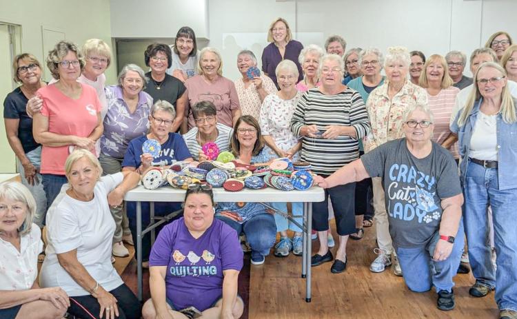 STITCHERS AND QUILTERS GATHER