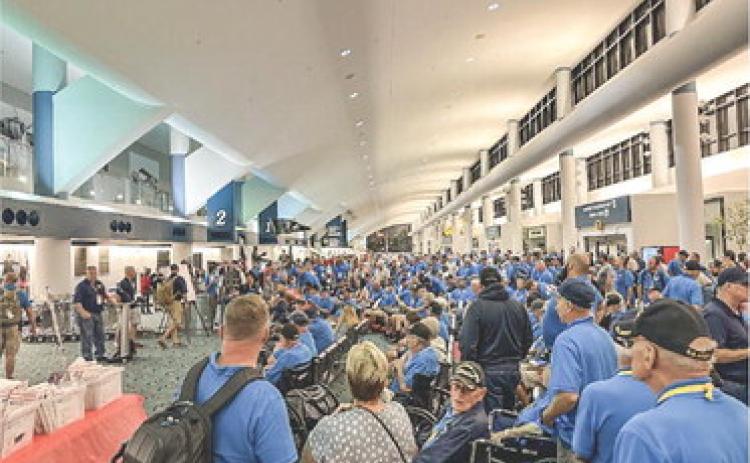 Veterans and their chaperones and families gathered in the main lobby of Bishop International Airport in Flint.