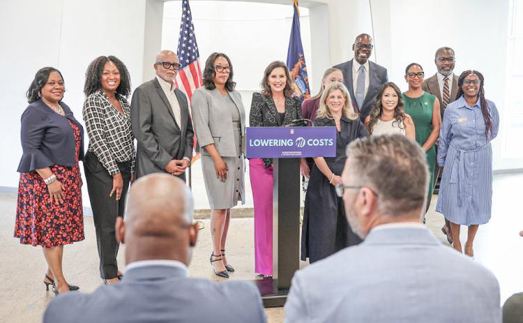 Governor Gretchen Whitmer is pictured announcing recipients of medical debt forgiveness collaborating with Undue Medical Debt.
