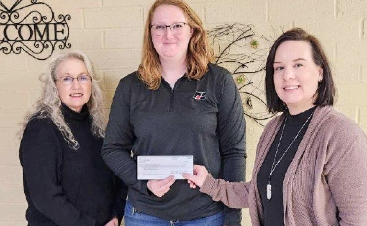 Sarah Hollon (center), Clare County Farm Bureau Young Farmer Co-Chair and golf scramble organizer presented the Gladwin Community Service Corp. – Council on Aging with a $620 donation.