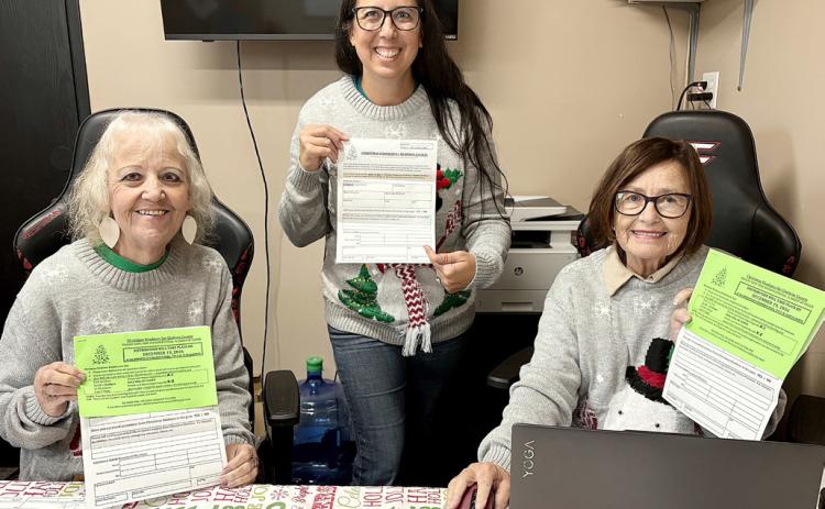 The Christmas Kindness Office gals pictured from left to right are: Brenda Povey, Amanda Trent, and Carolyn McNamara.