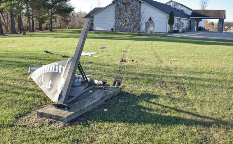 Tire tracks and the wiped out Community of Christ Church sign show the path of a vehicle that was involved in a crash with Sheriff Mike Shea last week.