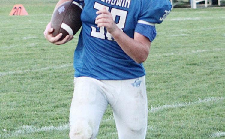 Jackson Fritz carries the ball for the Gladwin junior varsity football team during a recent game.