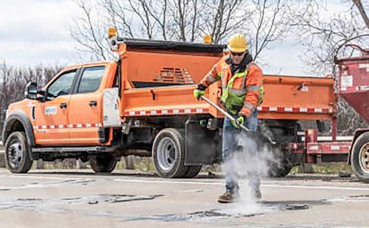 Department of Transportation crew fill a pothole on a state highway. MICHIGAN DEPARTMENT OF TRANSPORTATION