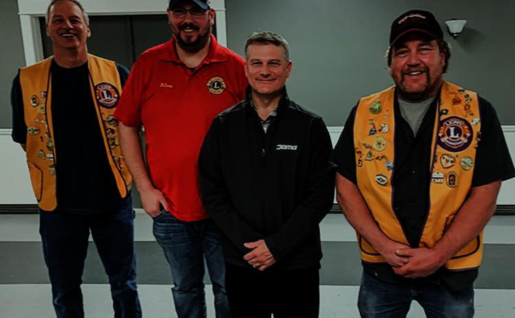 Pictured, left to right, are Lion, Craig Wolfe; new member, Allen Grove; new member, Brian Keeley; and Lion, Bob Killian.
