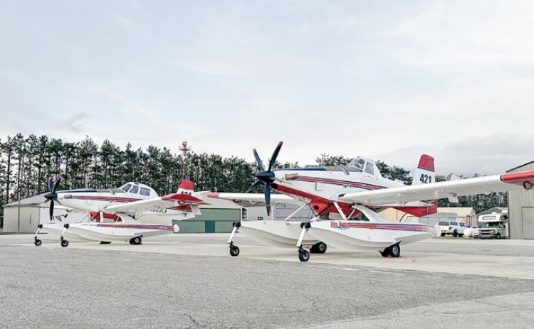 These planes – Air Tractor AT-802 models modified to scoop water for wildland firefighting – are flying for the DNR during the spring fire season.