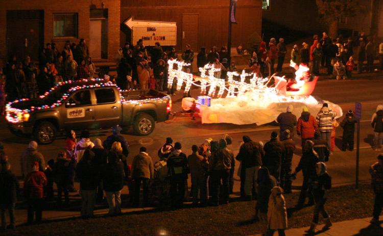 This photo was taken at the Gladwin Christmas parade in 2010. At that time, the parade ended in the city park, so they marched past the courthouse and entered the park via the street between the courthouse and the sheriff’s office. After assembling in the park, the community enjoyed a fireworks display. The park was also adorned with lighted decorations. Unfortunately, persistent vandalism put an end to that practice. PHOTO COURTESY OF BOB FREI