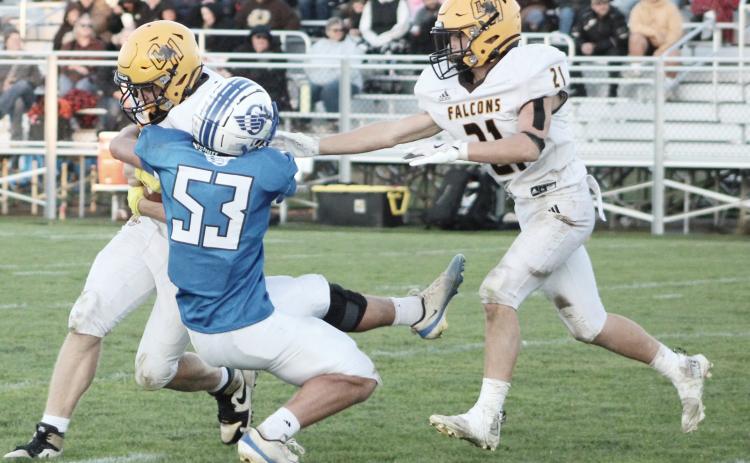 Gladwin’s Liam Pohlman makes a tackle for the loss during the first half of Thursday’s junior varsity game against Ogemaw Heights.