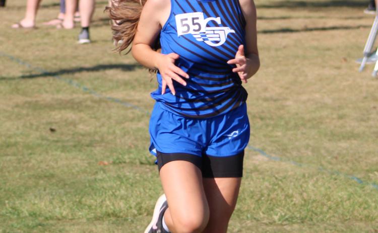 Gladwin’s Michaela O’Callaghan races to the finish line during a recent meet. The Flying G’s will run at the Northern Michigan Meet of Champions Saturday.