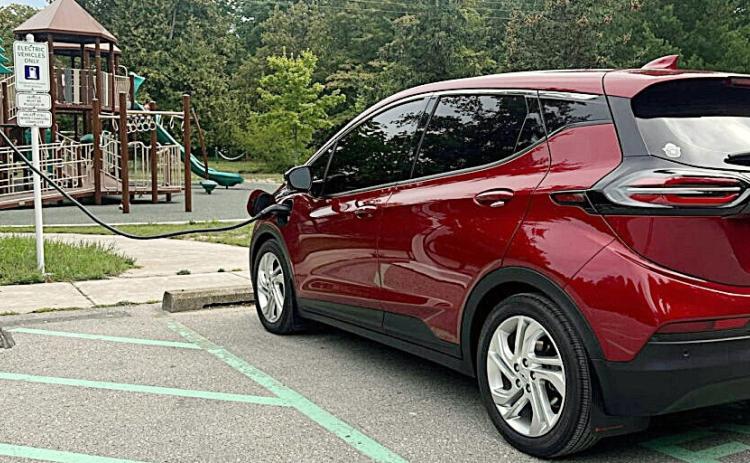 Electric vehicle charging at a park. MICHIGAN DEPARTMENT OF ENVIRONMENT, GREAT LAKES AND ENERGY