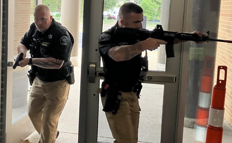 First responders trained as realistically as possible to deal with an armed assailant during a session Saturday at Gladwin Intermediate School.