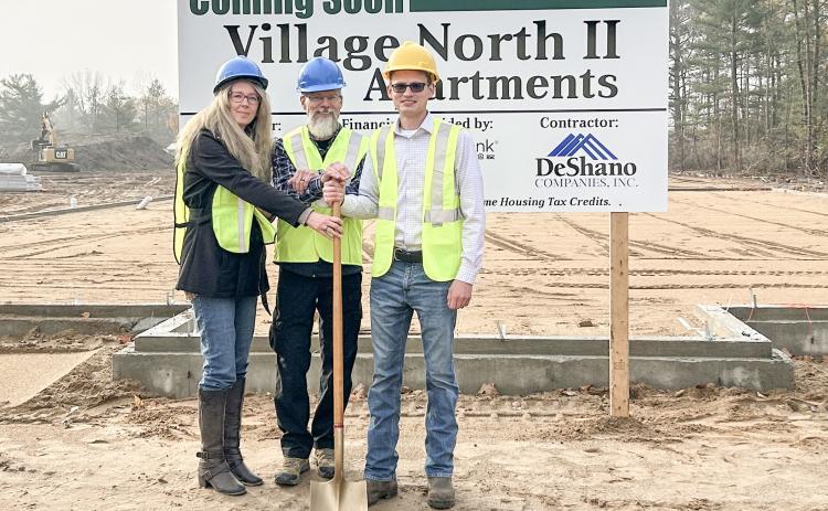 The groundbreaking ceremony for the Village North II apartments occurred on Tuesday, October 29. From left to right are Trisha, Chad, and Boone DeShano.