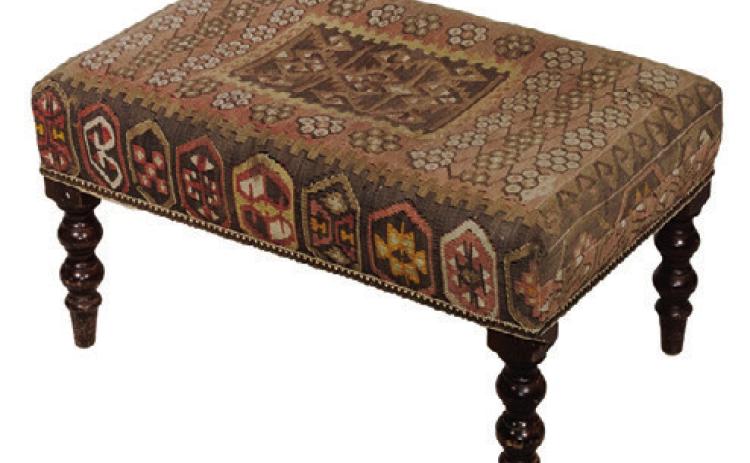 Rugs aren’t just for covering the floor. An antique kilim rug, a style originating in Western Asia, found another life as upholstery for a 20thcentury bench. THOMASTON PLACE AUCTION GALLERIES