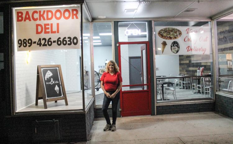 Back Door Deli have announced that their storefront is officially open and held their Grand Opening on Friday, October 6. Ronita Skinner is pictured in front of Back Door Deli’s new storefront. Coming with the new storefront is coffee, ice cream, and breakfast pizza. Breakfast pizza will be served from 7-11 a.m. on Friday and Saturday, and from 8-11 a.m. on Sunday every week.
