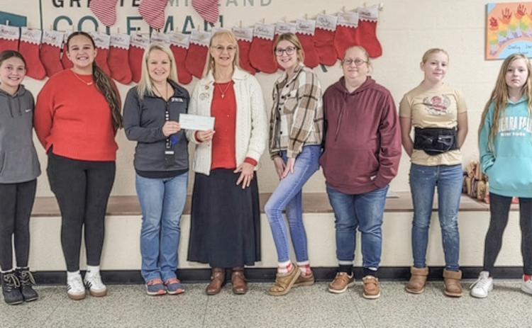 Pictured from left to right: Hadley Green, Mayela Cordova, Kari Wedge, Ann Sigsby, Ashlee Moore, Darci Cole, Heidi Cole, and Angelina Cole.