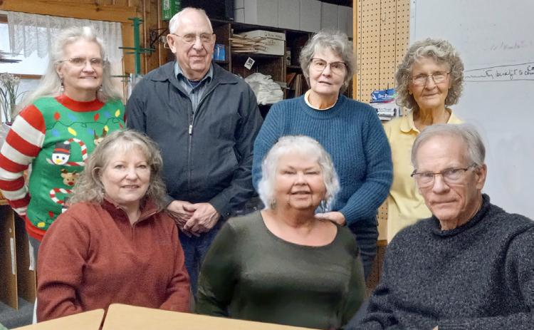 Pictured left to right, seated, are Connie Maedel Diehl, Linda Clark, and Mark Winslow. From left to right, standing, are Linda L. Hall, Ken Neubecker, Anne Cooke, and Patricia Riegle.