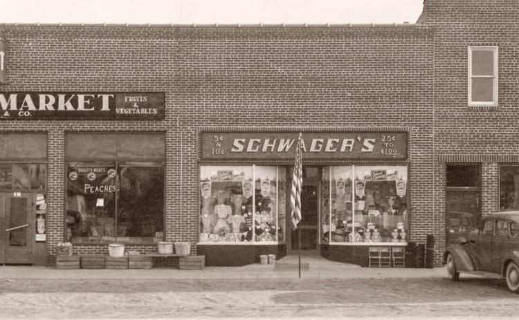 This building complex still stands on the south side of Cedar between Townsend and Silverleaf streets. The roof has been completely reconstructed and it has been remodeled several times since then. This building replaced previous structures that had been destroyed by a fire that destroyed most of the commercial block in 1936. Another fire in 1947 prompted the first major remodeling of this building.