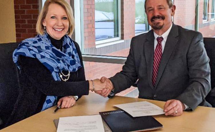 Pictured are Dr. Kristin Stehouwer, Provost and Vice President of Academics at Northwood University, and Tim Hood, President of Mid Michigan College.