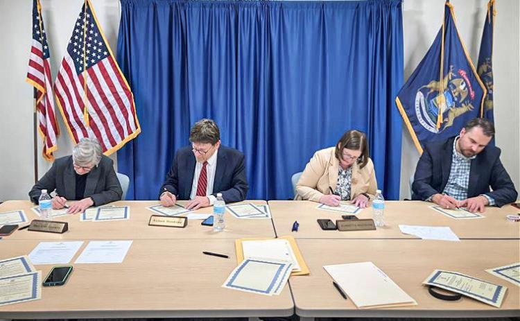 The Michigan Board of State Canvassers signed certificates to officially certify the results of the 2024 General Election. Pictured from left to right: Chair Mary Ellen Gurewitz (D), Vice-Chair Richard Houskamp (R), member Jeannette Bradshaw (D), and member Anthony Daunt (R).