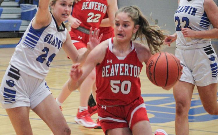 Beaverton’s Myah Hubble drives on Gladwin defender Breanna Campbell during the Flying G’s victory in the battle for the Cedar Cup last Tuesday.