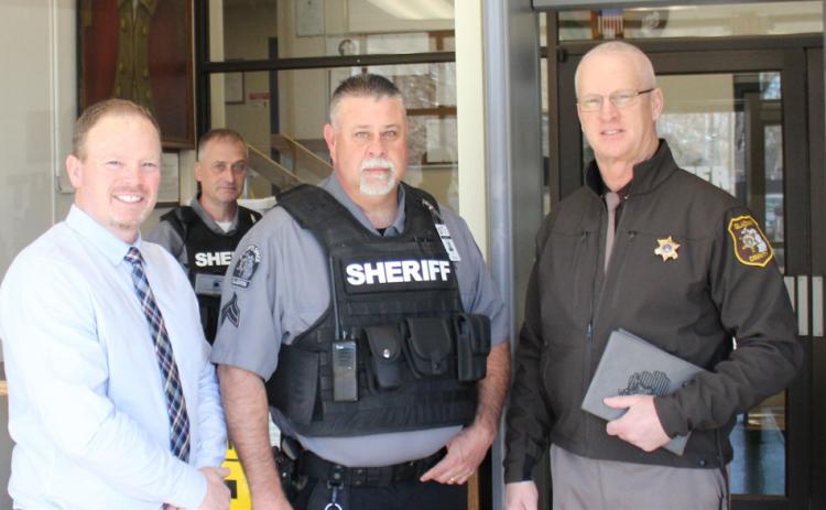 From left to right is Judge Joshua Farrell, Mike Smith, Trevor Demoines, and Sheriff Mike Shea at the Gladwin County Courthouse.