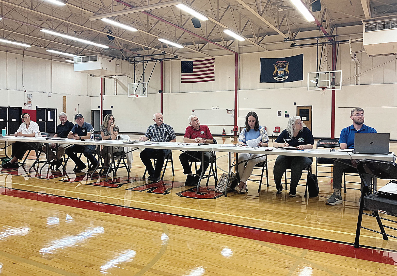 The Ross Lake Improvement Board presides over a meeting considering special assessments for weed remediation with residents and property owners Thursday at Beaverton Elementary School.